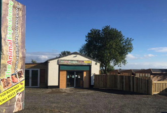 A view from the outside of the zoo and outside animal runs